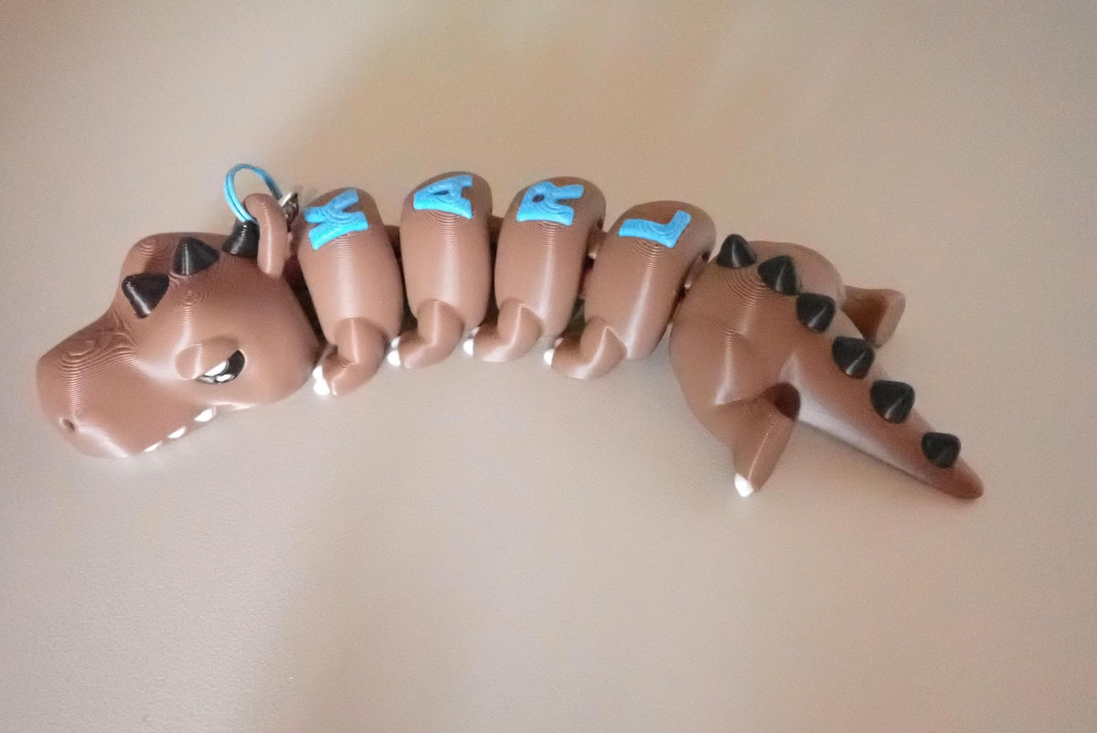 Personalisierter T-Rex Schlüsselanhänger - Flexibler 3D-Druck - Dino mit Wunschnamen